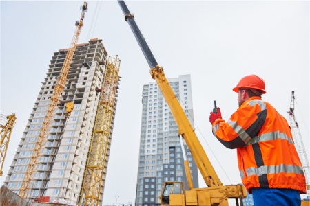 Site manager watching a crane